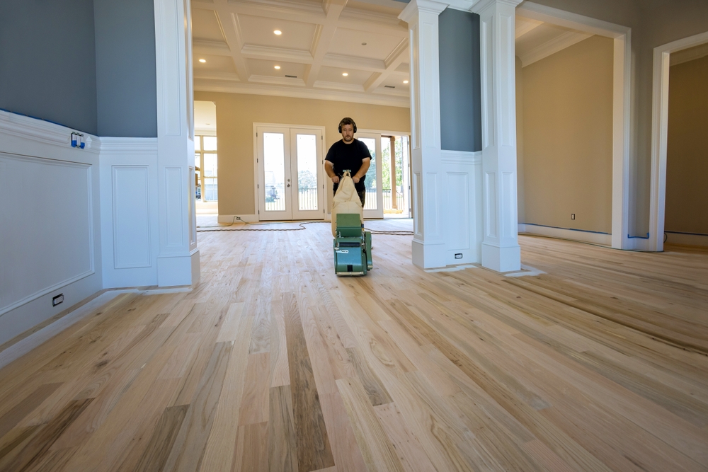 Hardwood floor specialist sanding wood floor in Massachusetts